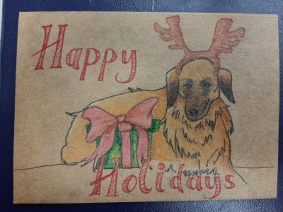A "Happy Holidays" card with a dog with an antler headpiece sitting with a gift box.